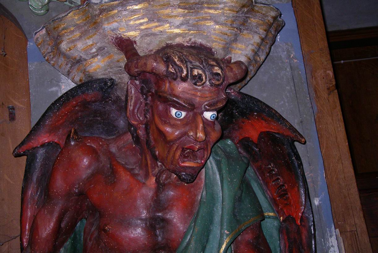 Statue of the Devil supporting the Holy Water Stoup
